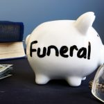 Funeral,Plan,Written,On,A,Side,Of,Piggy,Bank.